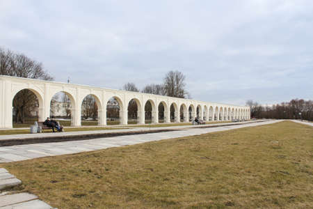 People relax on benches. Architectural tourist complex of Novgorod Yaroslav's Court.の写真素材