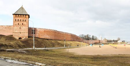 The beach near the walls of the Kremlin. Types of towers and walls of Kremlin in Veliky Novgorod.の写真素材