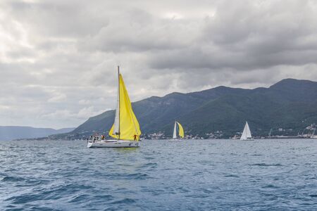 Regatta in the bay under a cloudy sky. Sea race on yachts in the Bay of Kotor Adriatic Sea.のeditorial素材