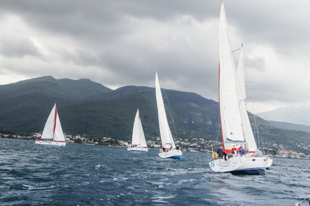 Sailing regatta under a cloudy sky. Sea race on yachts in the Bay of Kotor Adriatic Sea.のeditorial素材