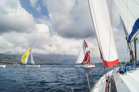 Sailboats under the low clouds. Sea race on yachts in the Bay of Kotor Adriatic Sea.のeditorial素材