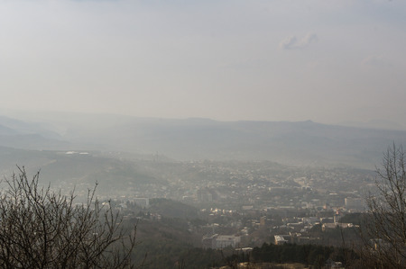 Misty gave over the city. Skyline panorama of the surrounding area and mineral water.