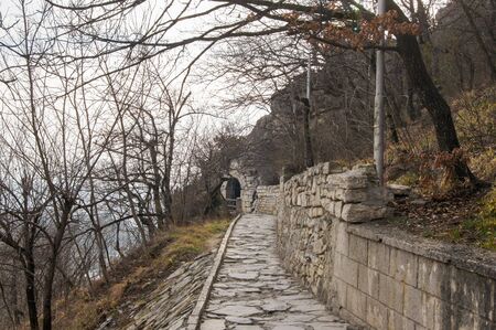 Stone path to the grotto. Nature and landscape in the spring with elements of small architecture.の写真素材