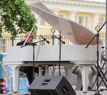 The musician playing the piano. Speech by David Goloschekin with his jazz group on the Arts Square in St. Petersburg.のeditorial素材