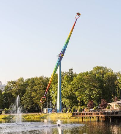 Vertical Carousel in an amusement park. Amusement and extreme rides for teenagers and adults.のeditorial素材