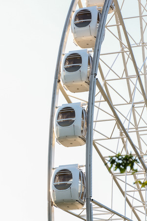 Cabs ferris wheel. Amusement and extreme rides for teenagers and adults.のeditorial素材