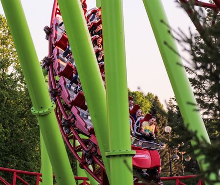 People at the bottom of the loop. Amusement and extreme rides for teenagers and adults.のeditorial素材