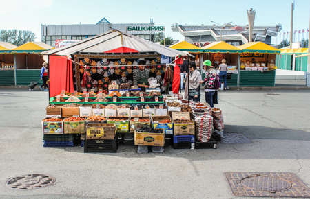 Stalls with dried fruits. Autumn Exhibition Fair Farmer at the fairgrounds.のeditorial素材