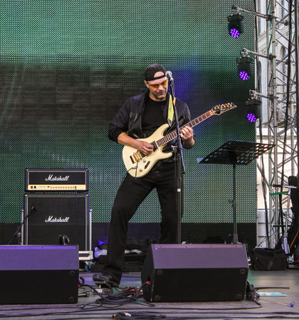 Speech guitarist on stage. Pop and rock musicians on Harley Davidson festival in St. Petersburg.のeditorial素材