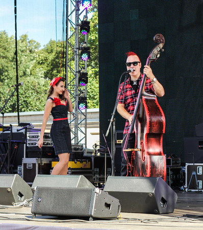Duet of musicians with bass. Pop and rock musicians on Harley Davidson festival in St. Petersburg.のeditorial素材