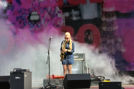 Musician in the smoky scene. Pop and rock musicians on Harley Davidson festival in St. Petersburg.のeditorial素材