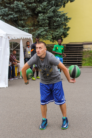 An athlete with two balls. A group of young people of different nationalities with balls.のeditorial素材