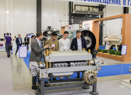 People at the exhibition. Annual Petersburg Gas Forum which takes place in Expoforum.