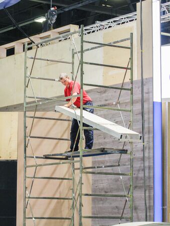 Work on scaffolding. Construction and preparation work for the St. Petersburg Gas Forum.のeditorial素材