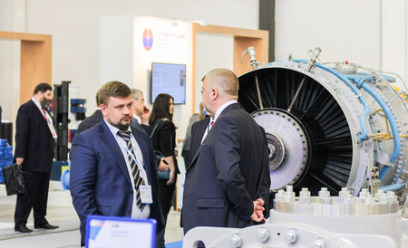 Business people near the equipment. Annual Petersburg Gas Forum which takes place in Expoforum.