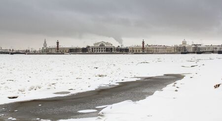 Spit of Vasilyevsky Island in winter. Types of quays of St. Petersburg with winter Neva River.の写真素材
