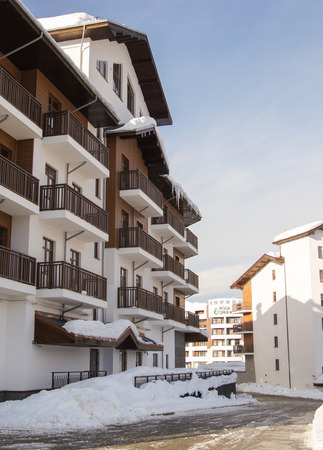 Winter ski village street. Houses and hotels in mountain-skiing village of Rosa Khutor.のeditorial素材