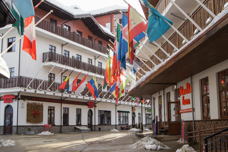 Flags on buildings. Houses and hotels in mountain-skiing village of Rosa Khutor.のeditorial素材