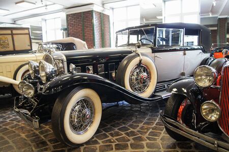 Exclusive Vintage cars on wheels with spokes. The museum of vintage cars and military equipment.のeditorial素材