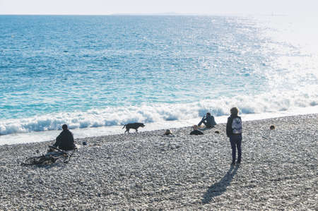 People relaxing on the beach. People and tourists having a rest on the Cote d'Azur.の写真素材