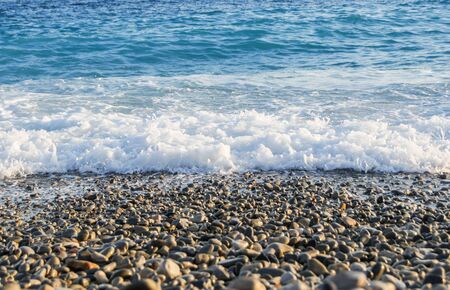 White sea foam on the shore.の写真素材