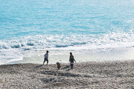 A group of children on the Cote d'Azur. People and tourists having a rest on the Cote d'Azur.の写真素材