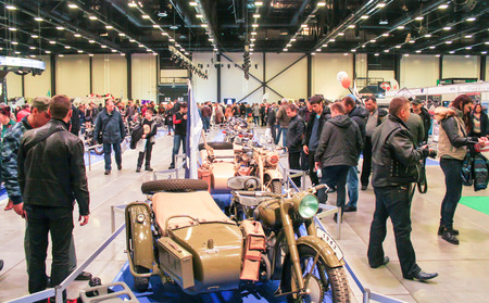 A crowd of people and motorcycles. Visitors and participants of the annual moto-salon in St. Petersburg.のeditorial素材