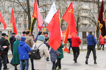 Festive column with flags. Holding a festive May demonstration and a rally in the provincial cities...