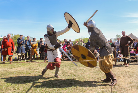 Battle of the ancient Vikings in armor. Knight tournament at the festival of the ancient Vikings in...