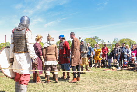 People at a Viking tournament. Knight tournament at the festival of the ancient Vikings in St. Petersburg. Petersburg.のeditorial素材