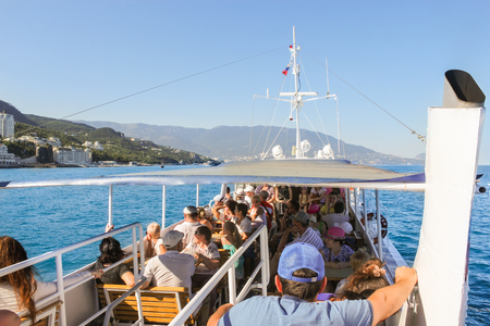 People on a sea walk. Sea excursion on a small tourist ship.のeditorial素材