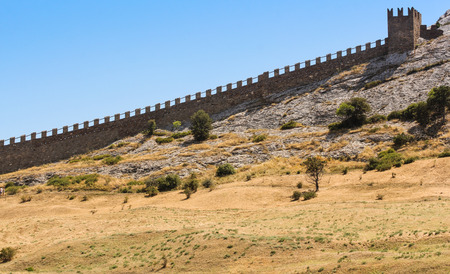 The jagged wall of the Genoese fortress. Genoese ancient fortress near the city of Sudak.の写真素材