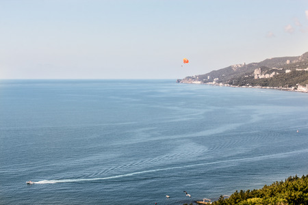 Skydiver over the sea.の写真素材