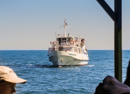Ship in the sea. Streets and embankments of the seaside city of Yalta.のeditorial素材