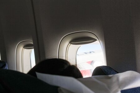 Portholes in an airplane.