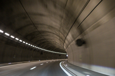 Driving by car through mountain tunnels.の写真素材