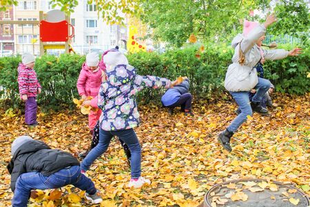Photo of children in the autumn kindergarten on the street.のeditorial素材