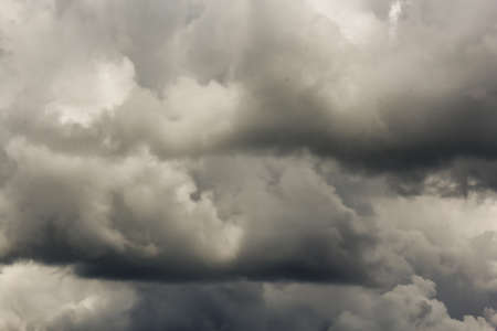 Picturesque clouds in the sky backlit by the sun.