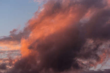 Picturesque clouds in the sky backlit by the sun.