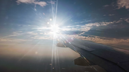 Views from an airplane window of clouds under the wing.の写真素材