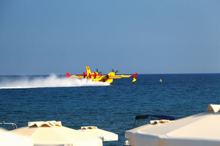 Splashdown (water landing) on ??the sea seaplane tourist summer resort.の写真素材