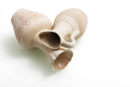 Two decorative jar with shadow lying on white background.の写真素材