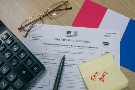 Mumbai, India- 1 Aug 2021: France Income tax return form on the table along with Australian flag. Tax filling concept 2021.Selective focus.の写真素材