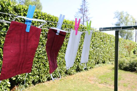 face masks drying on a clothes line