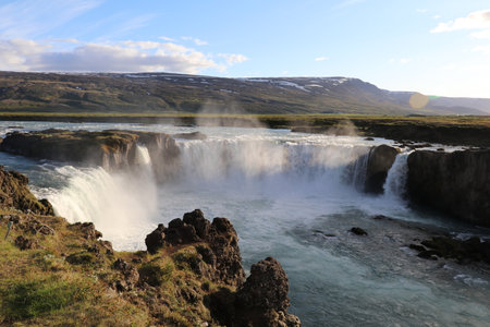 Godafoss waterfall in Iceland during golden hour on a sunny dayの写真素材