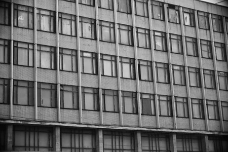 old facade office building of glass and concrete in black whiteの写真素材