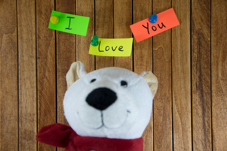 Teddy Bear and the words "I Love You" in the wooden backgroundの写真素材