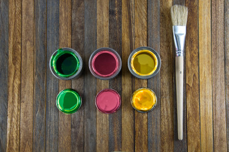 Home improvement, colorful paint cans on the wooden backgroundの写真素材