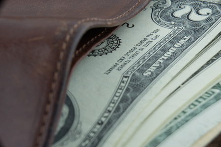 Wallet and two dollar bill, super close upの写真素材