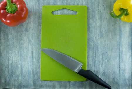 Cutting Board and knife on wooden table backgroundの写真素材
